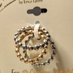 Erica brand. Set of three rings in silver and gold hues.NWT.